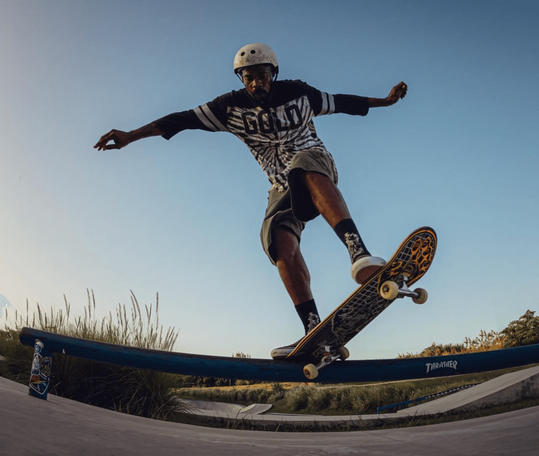 Skater performing a trick in the bowl at night
